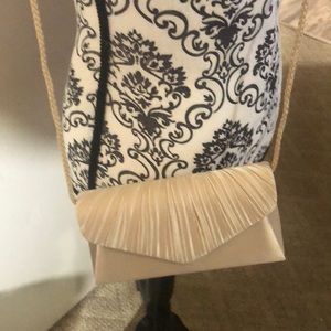 Champagne cross body clutch bag
